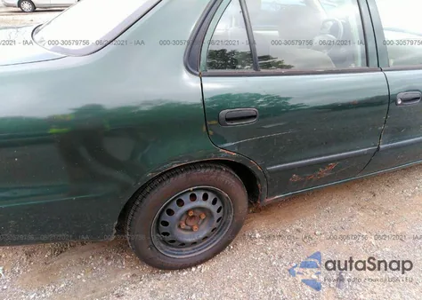 2001 Toyota Corolla Ce z USA, uszkodzony, nr VIN 2T1BR12E11C435727